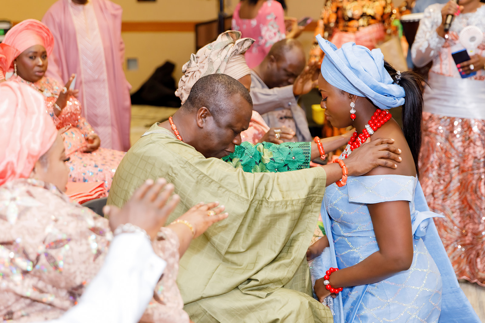 Bride getting blessings during Nigerian and American traditional wedding at Truhlsen Campus Events Center at UNMC