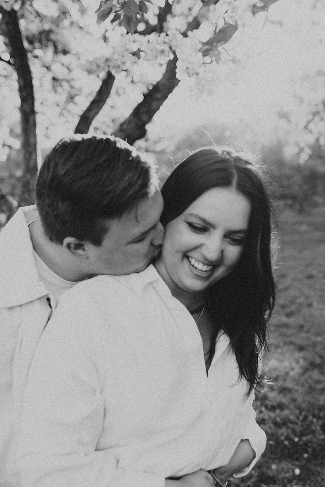 couple laughing together during their engagement session