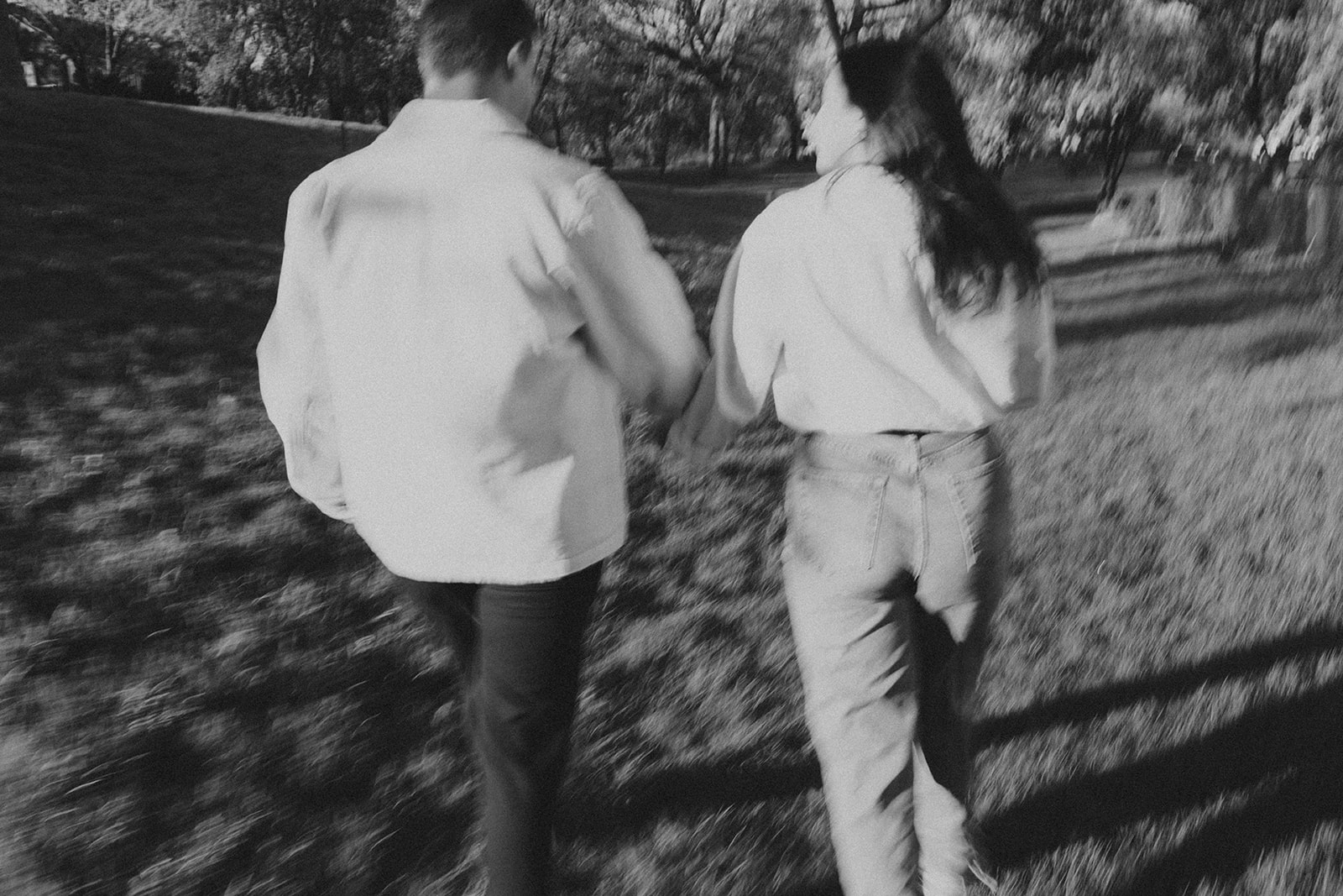 motion blur photo of couple walking together