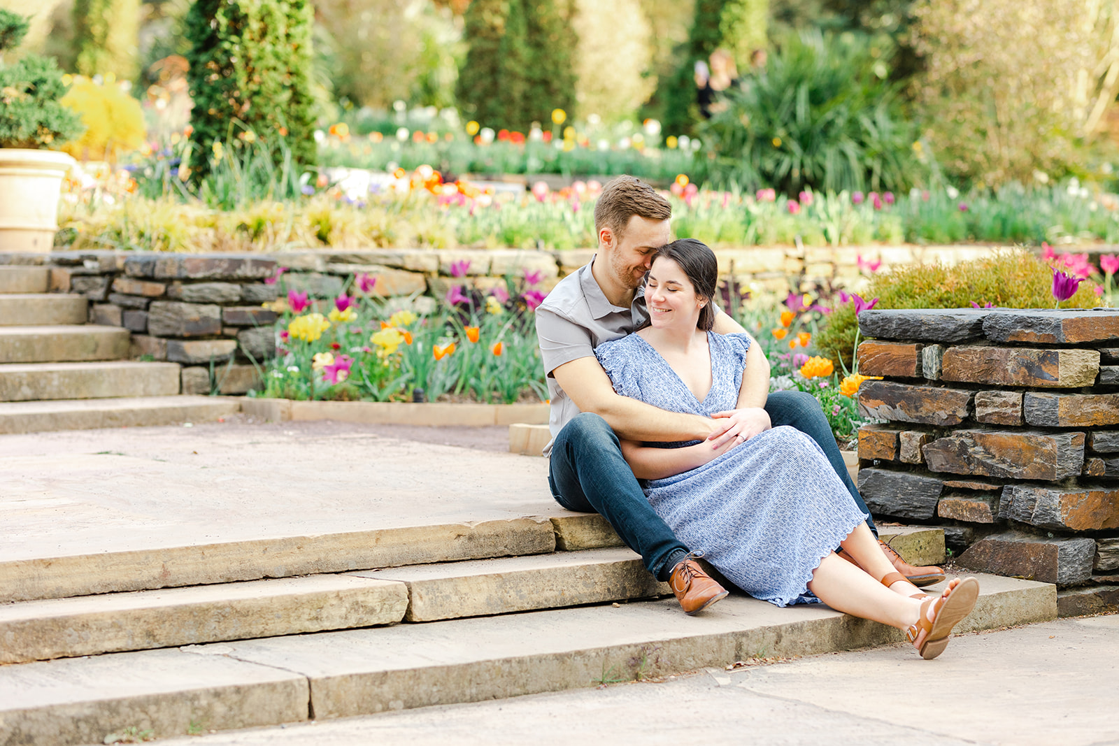 Couple sitting in the tulip garden at Duke Gardens