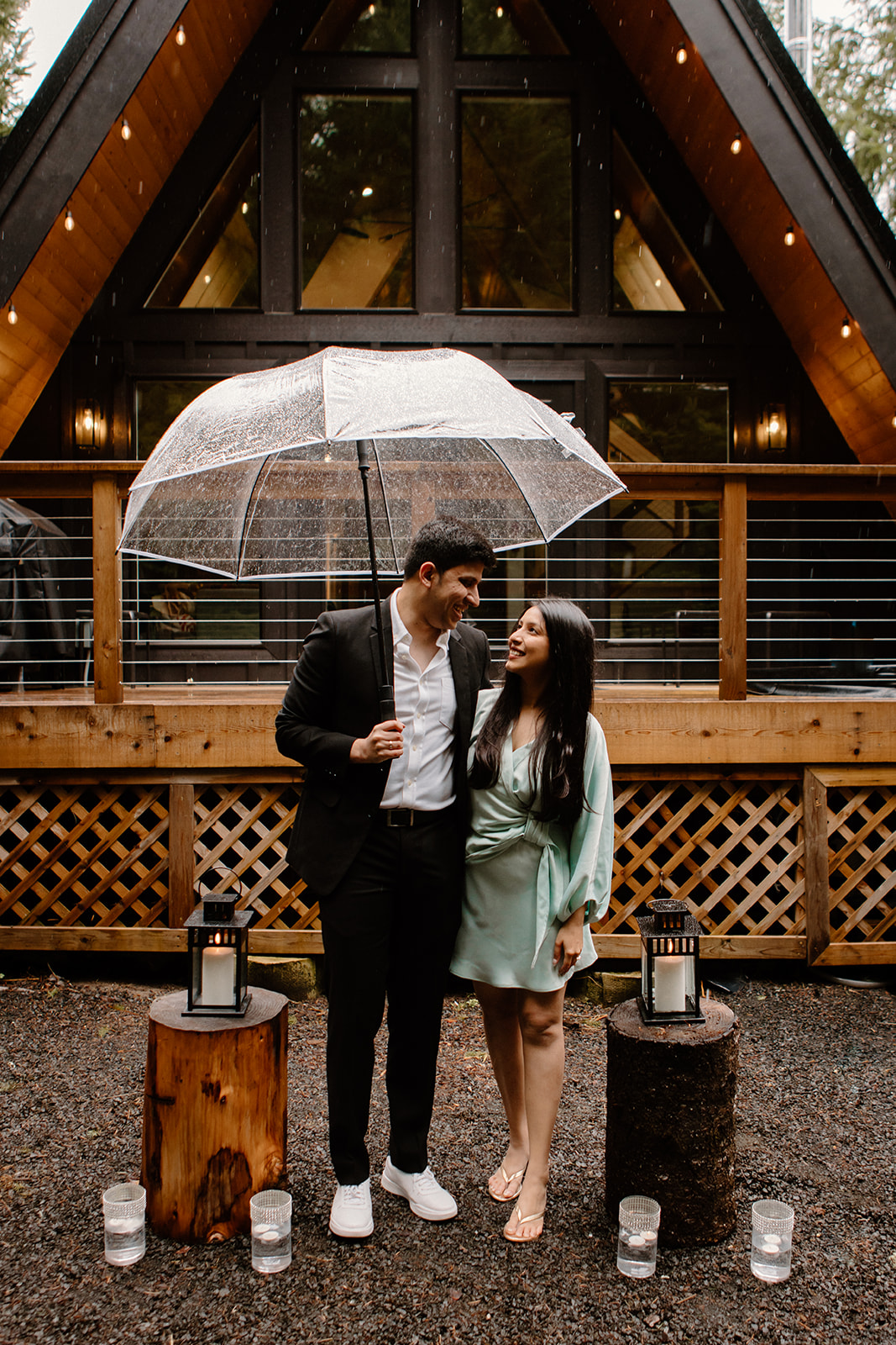 A couple share a ring exchange ceremony at an A-Frame cabin at the base of Mount Rainier to celebrate their engagement.
