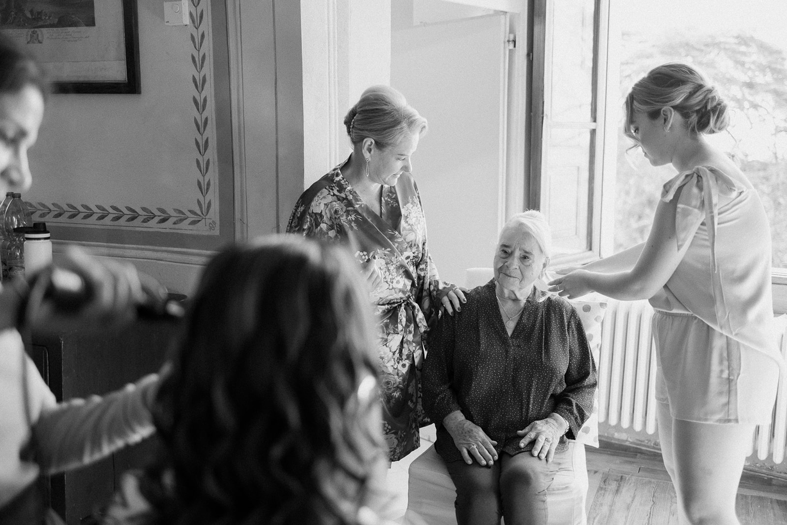 bride surrounded by family and grandmother