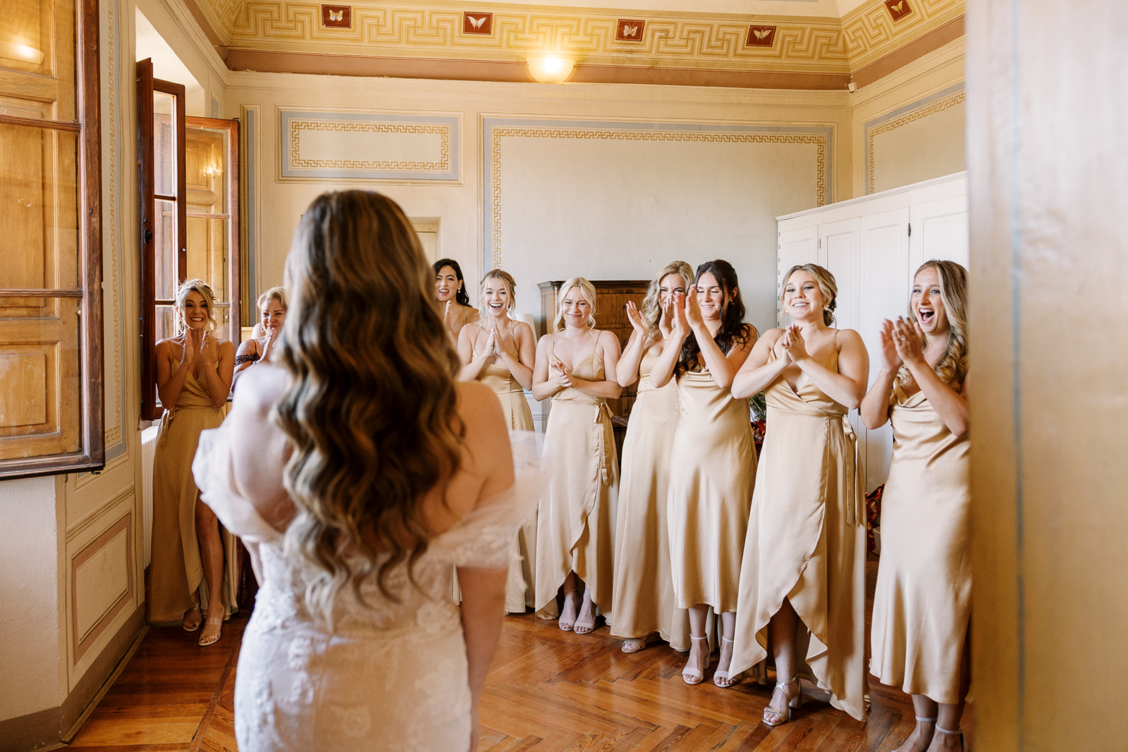 bride reveals herself to bridemaids during Italy wedding at Villa Catignano