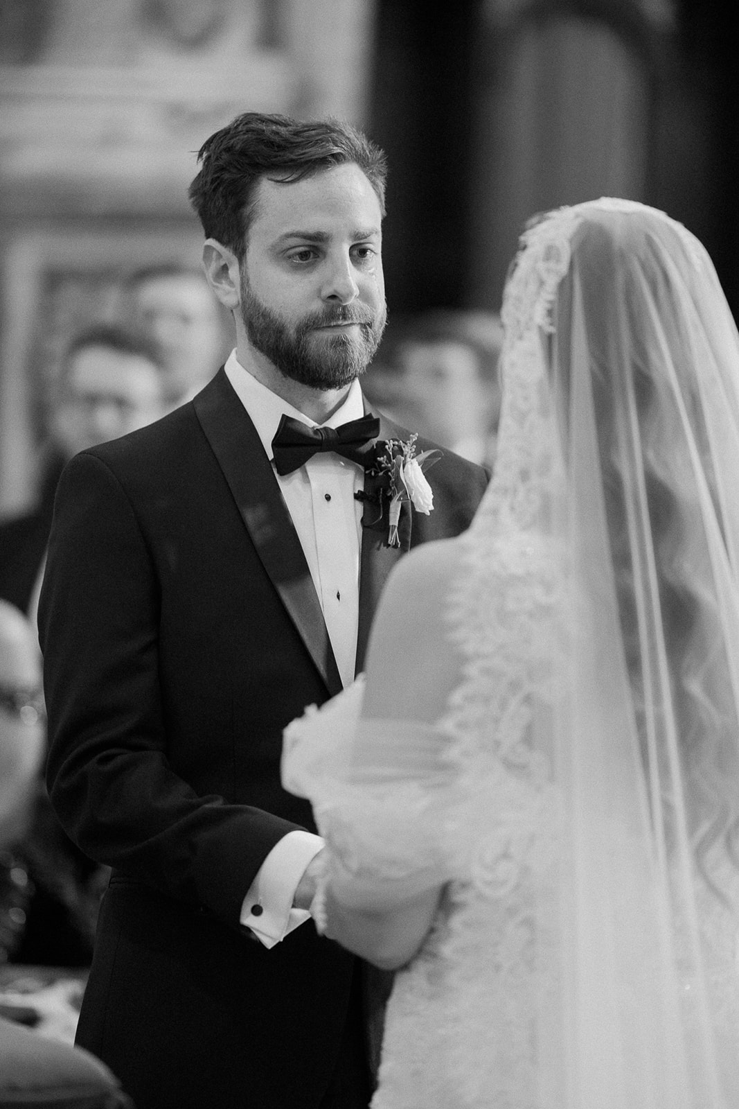groom sheds a tear during vow exchange during ceremony