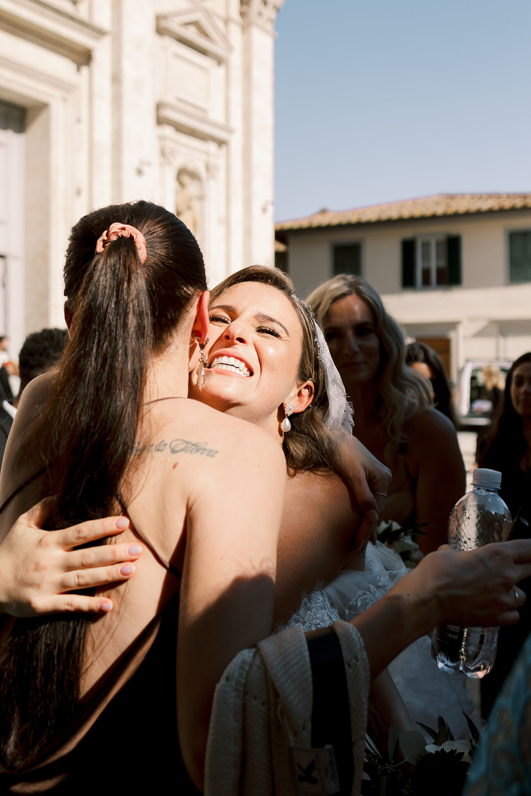 bride hugs guests