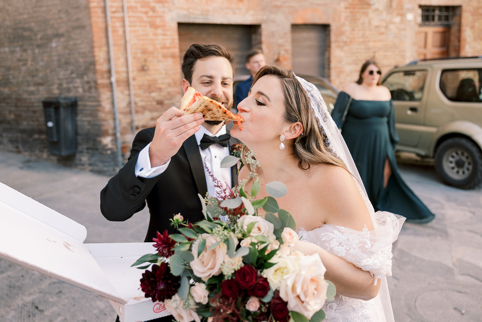 bride gets fed pizza