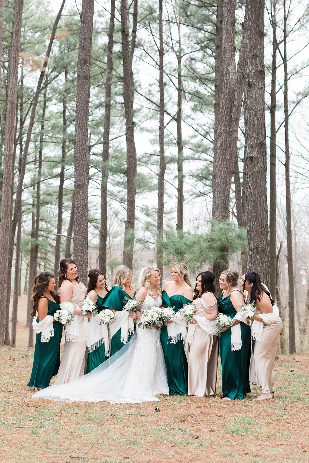Bride and bridesmaids with scarves and emerald green bridesmaid dresses