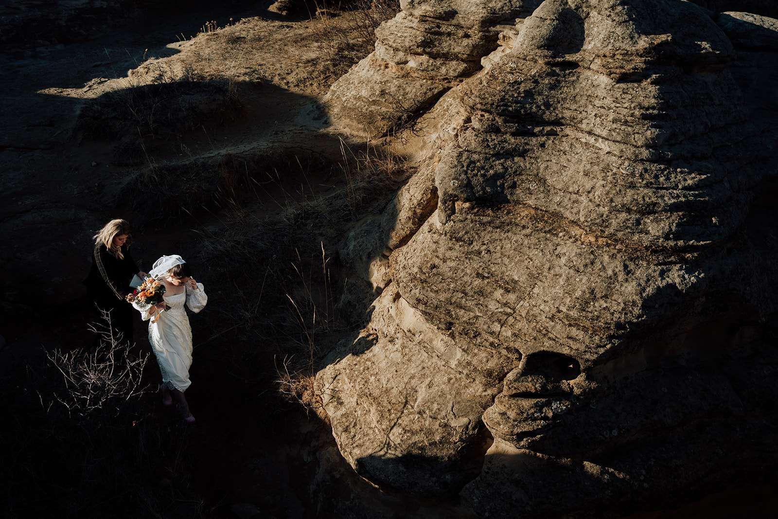 A couple who eloped in Writing on Stone provincial park say their vows standing on the hoodos