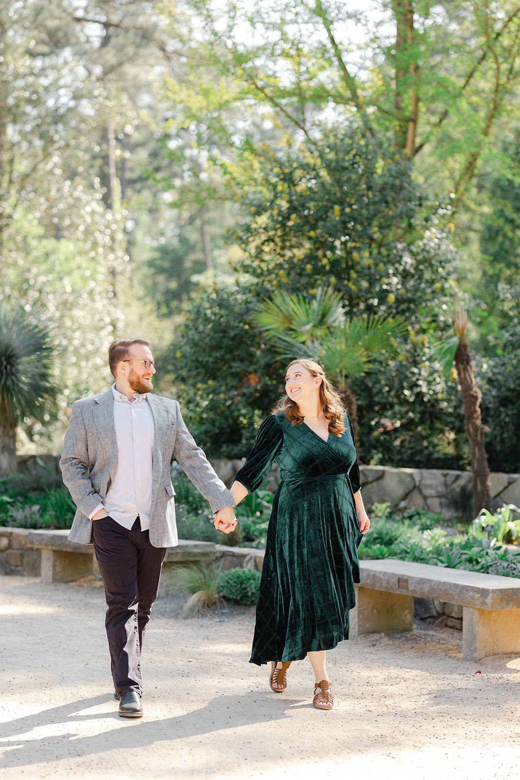 Couple walking through Duke Gardens for their spring time engagement session