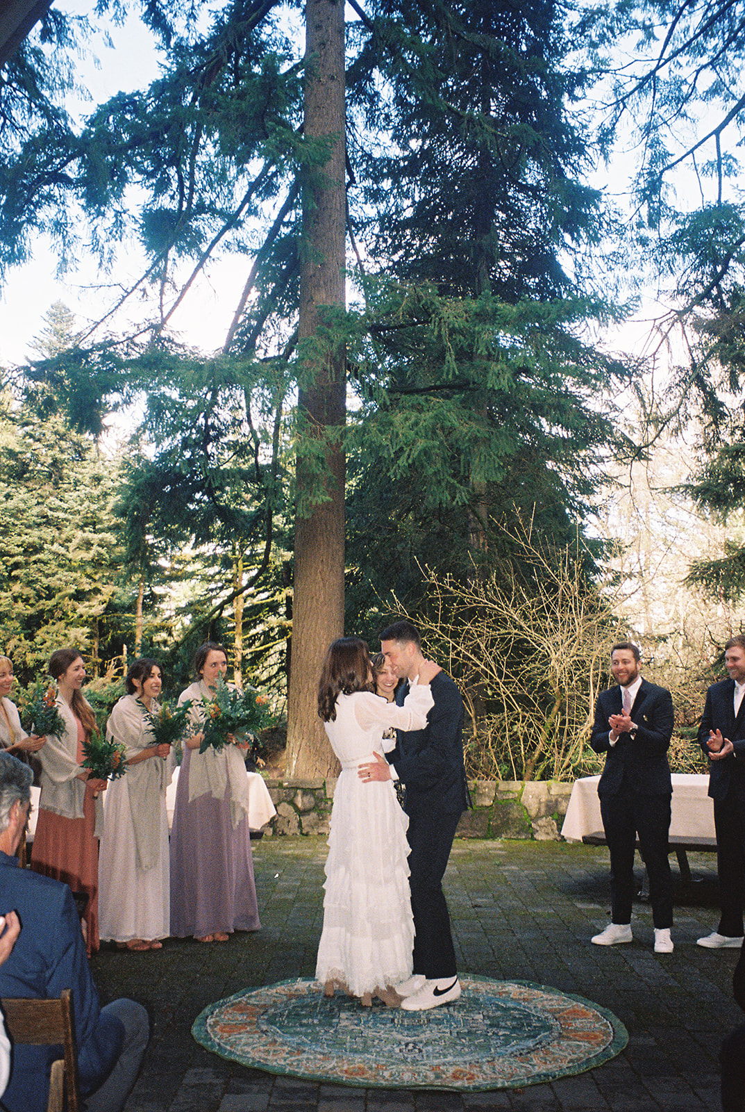 couple kissing during their ceremony at Hoyt Arboretum