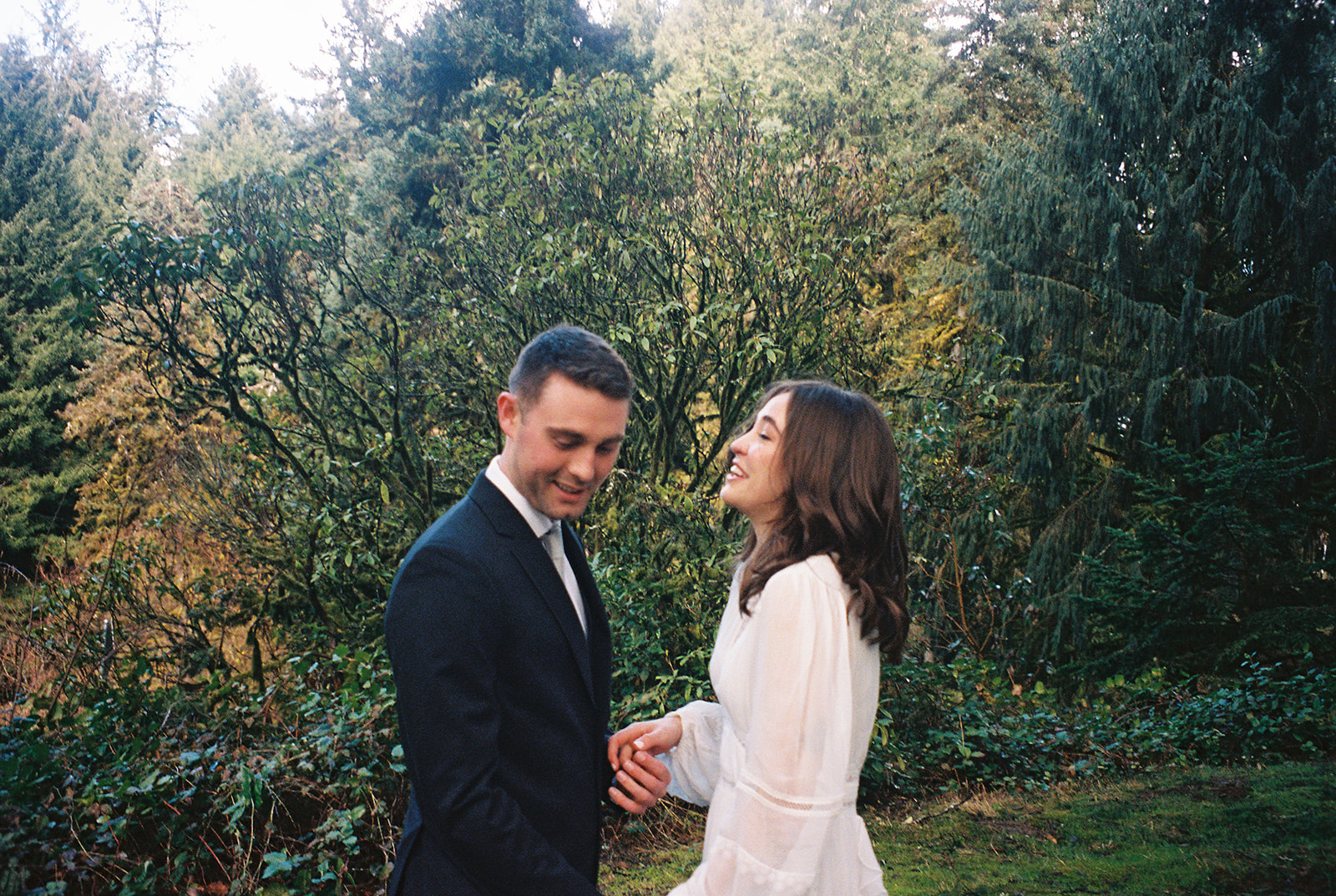 a couple laughing together on their wedding day