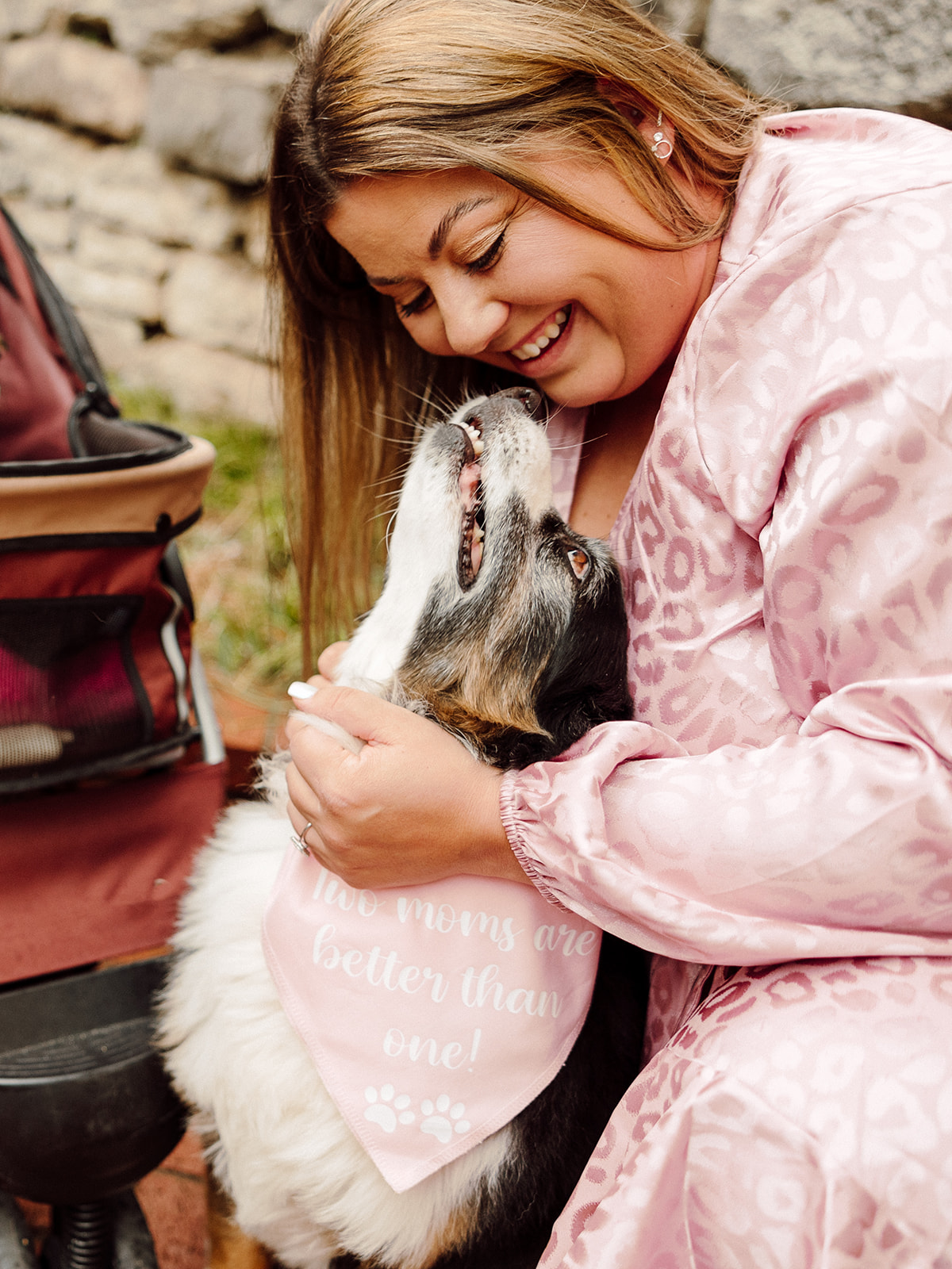 Woman smiling at dog during their City Engagement Session