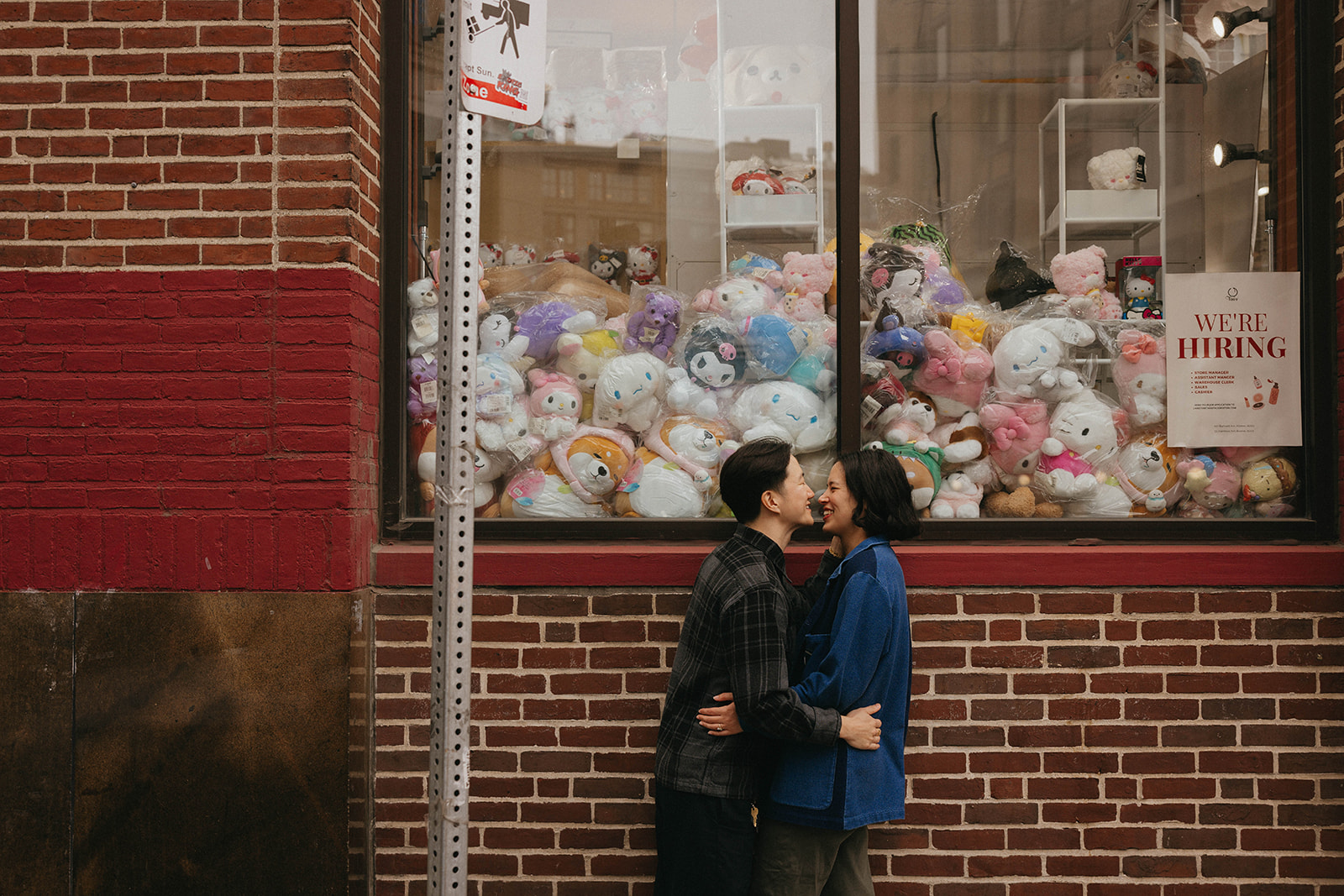 soo bin and julie pose outside of the plushie store in downtown chinatown in Boston