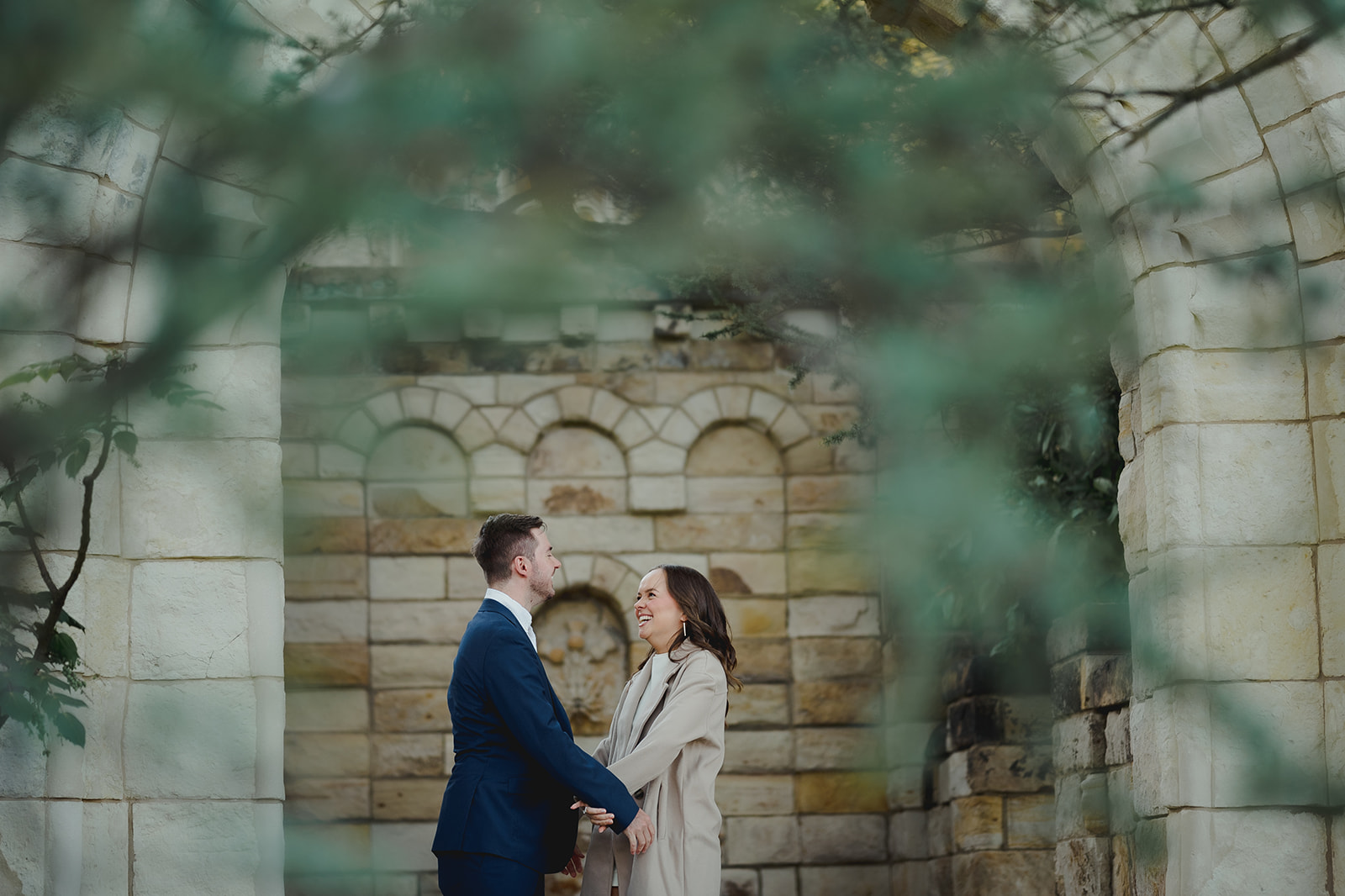 Engagement session shot showing couple's shared happiness at Bishop's Garden, Washington D.C.