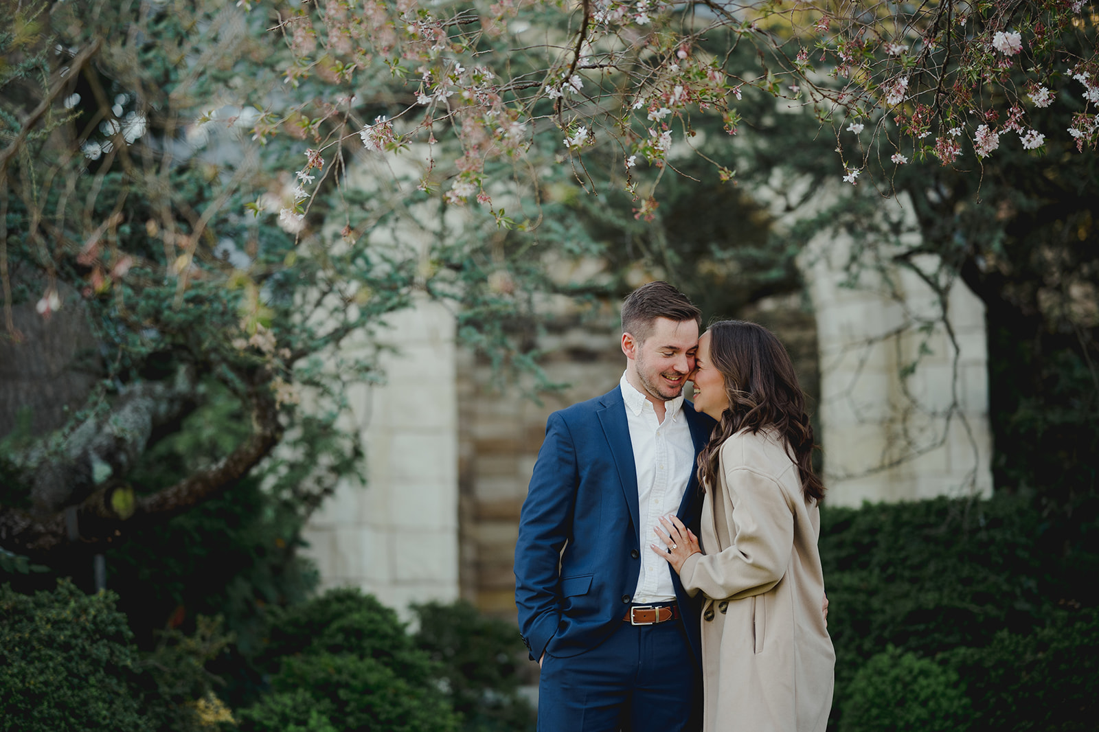 Engagement session shot showing couple's shared happiness at Bishop's Garden, Washington D.C.