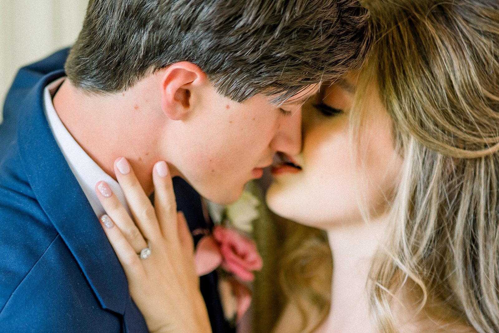 Bride and groom sharing a romantic kiss, showcasing a destination wedding at Cairnwood Estate.