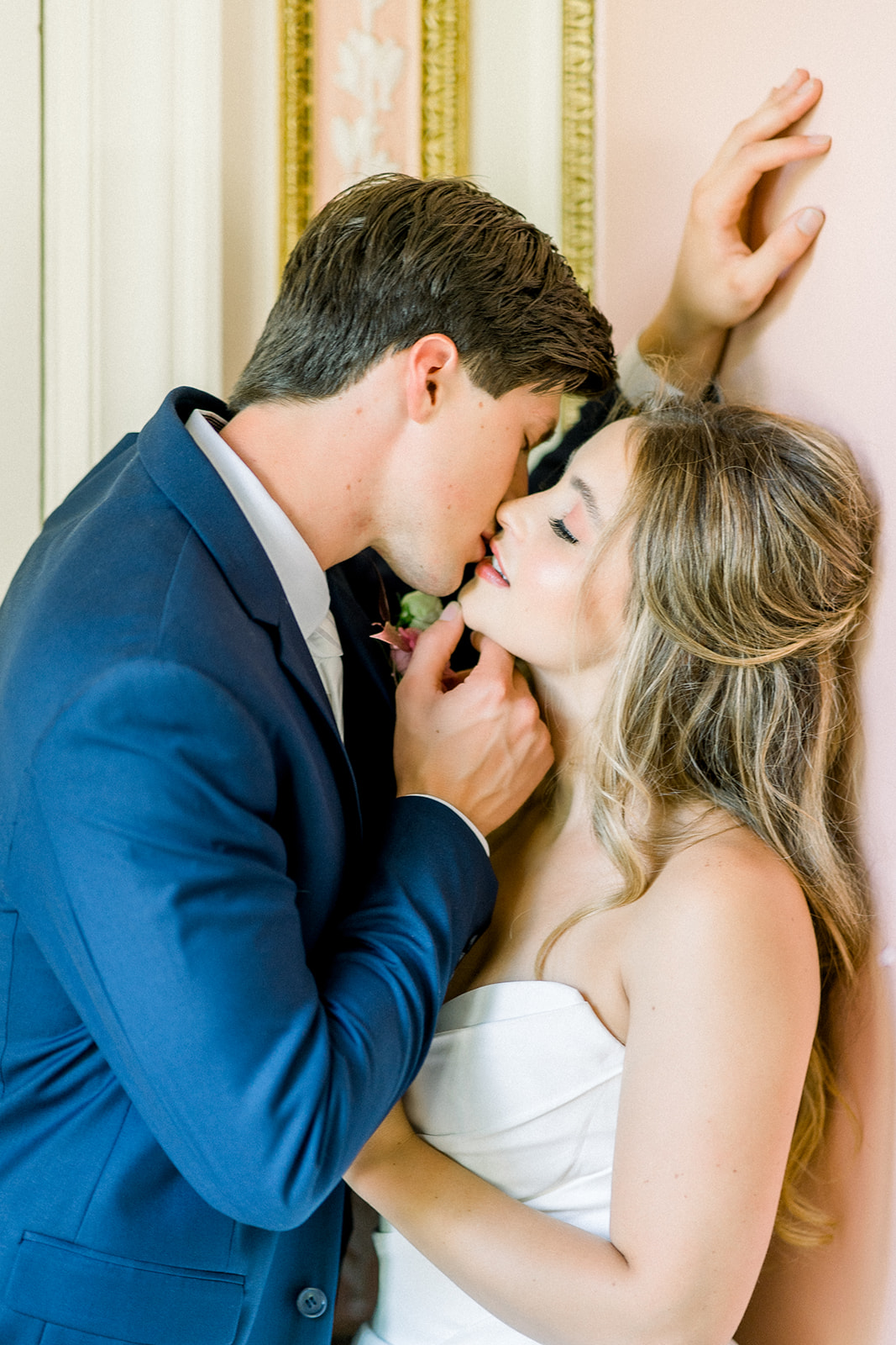 Bride and groom sharing a romantic kiss, showcasing a luxury destination wedding at Cairnwood Estate