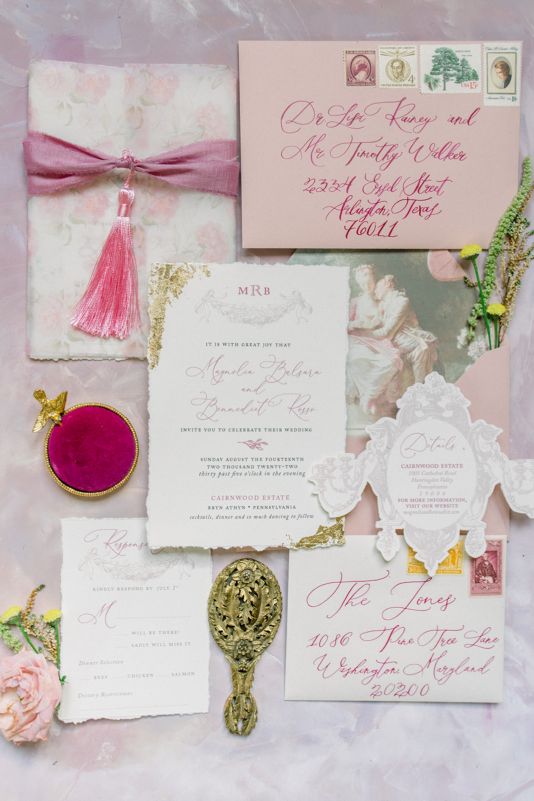 Elegant  luxury destination wedding invitation suite on blush fabric with gold vintage mirror and florals