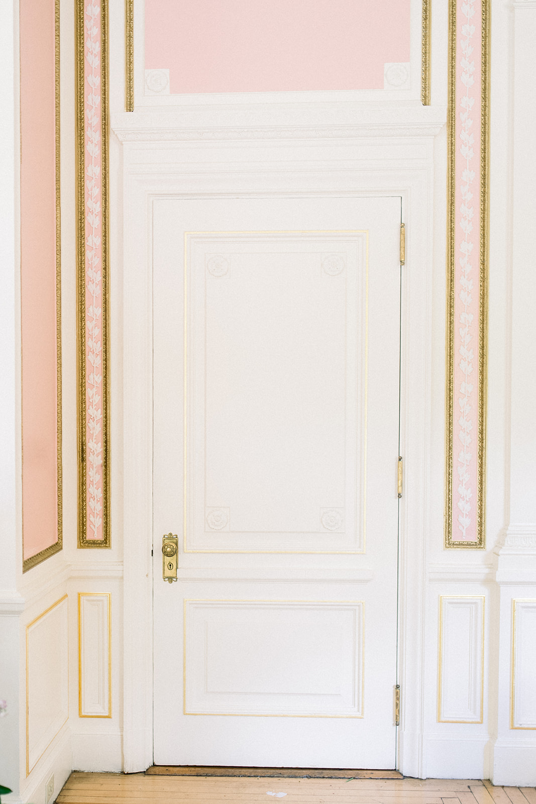 historic white door on a white wall at luxury destination wedding