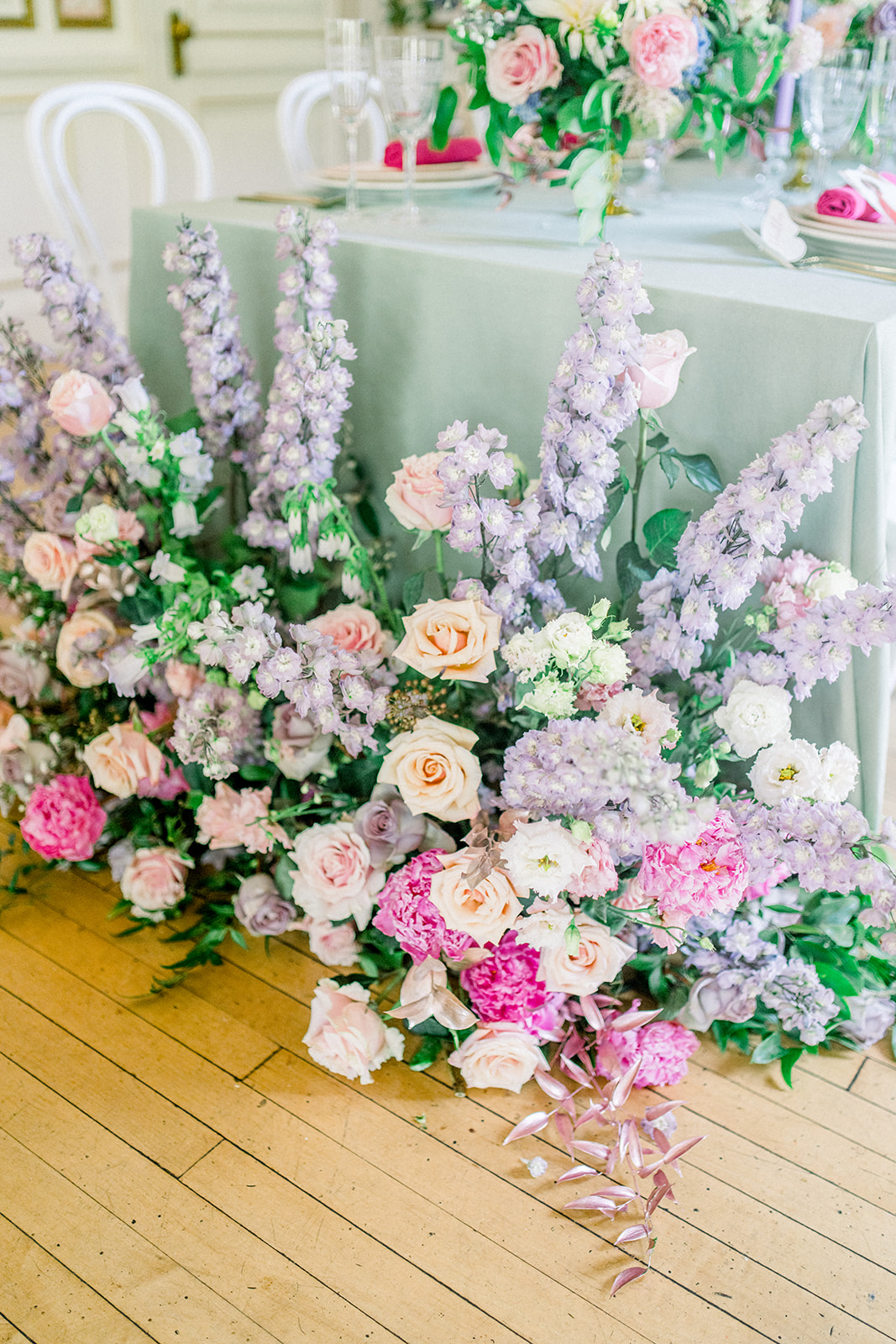 Lush floral arrangement centerpiece embodying luxury destination wedding theme