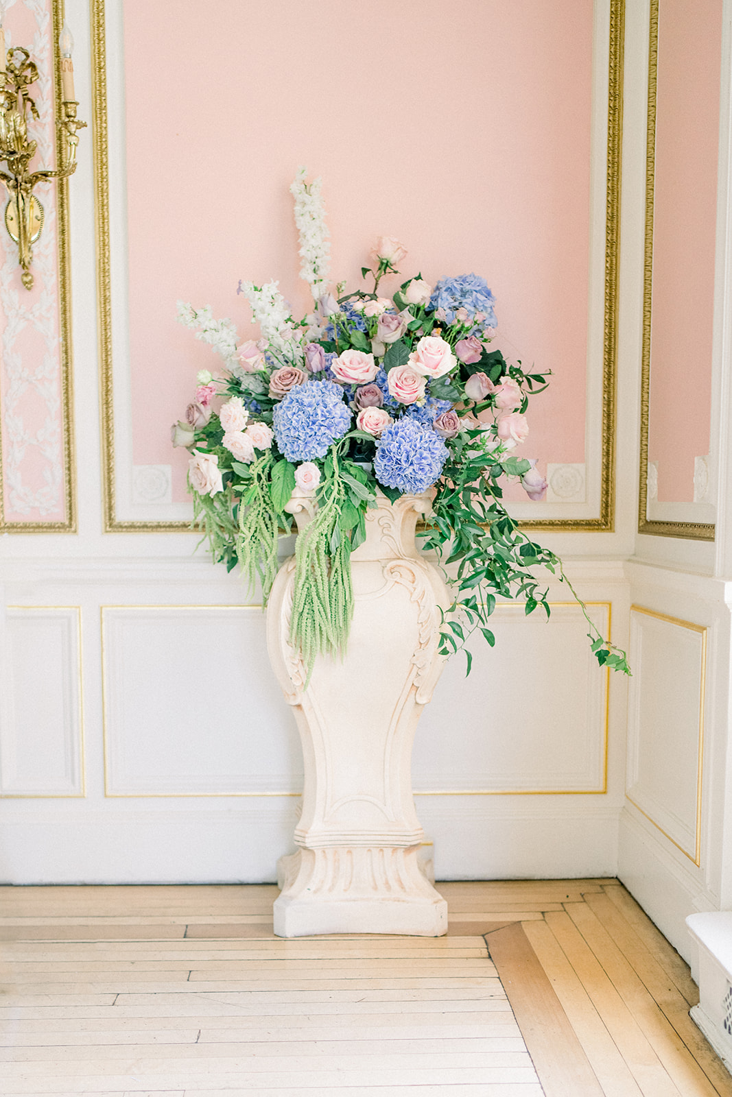 Luxury wedding floral decor featuring a pastel pink and sage green