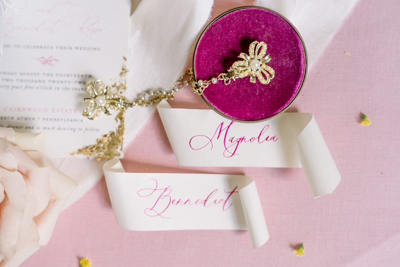 Pink wedding calligraphy place cards add a touch of luxury to details at a destination wedding at Cairnwood Estate