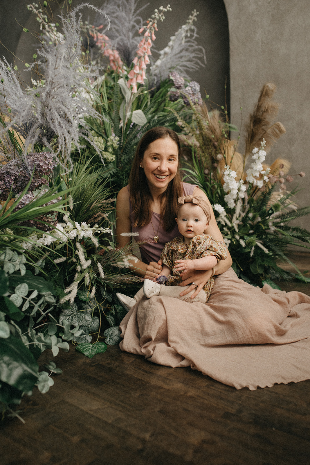 Photo of a mother and baby girl in a garden them studio in Toronto