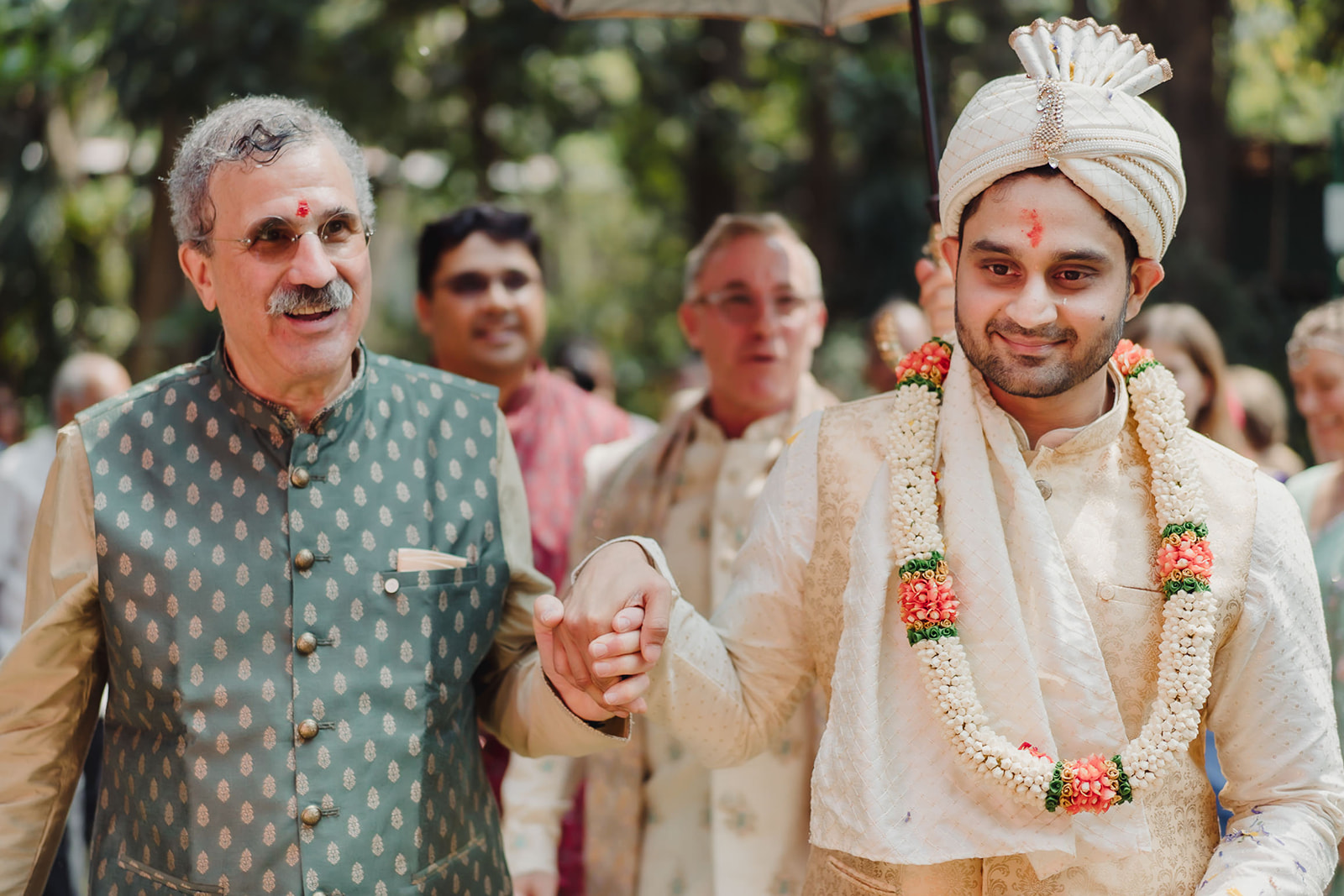 Groom escorted by his father-in-law into the mandap