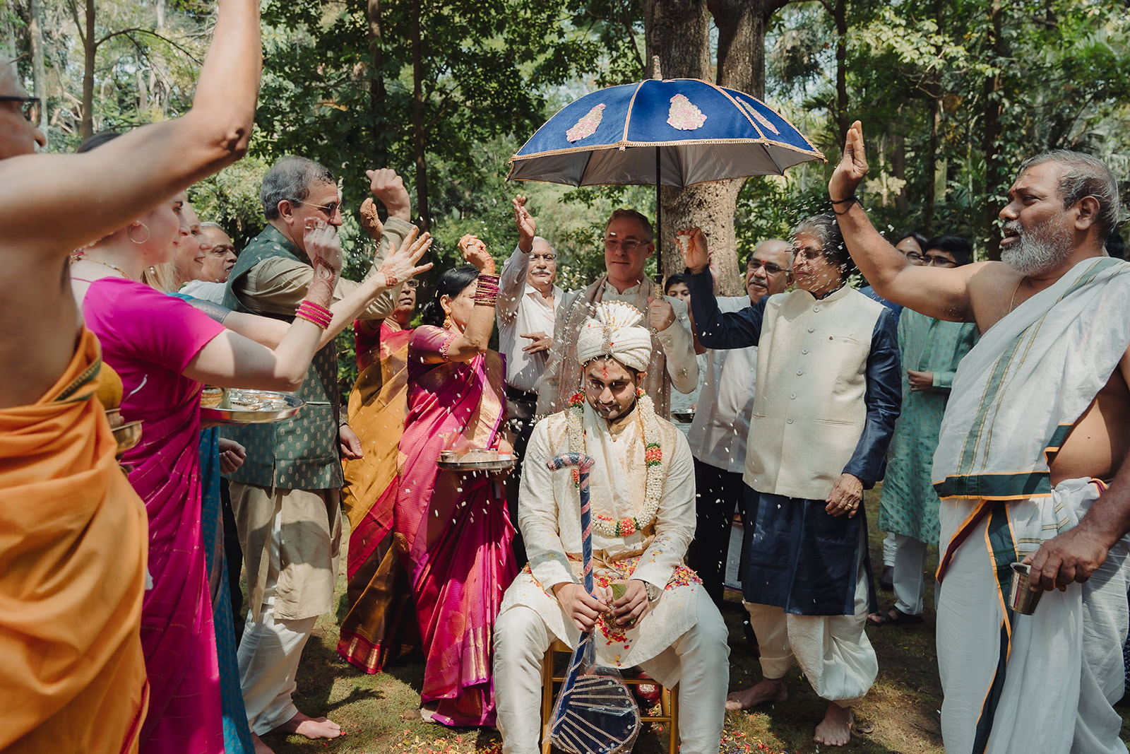 Groom celebrated with a shower of rice by family