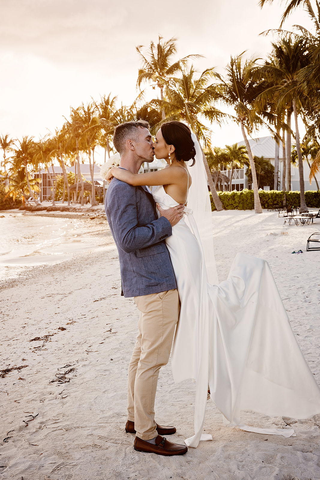 bride and groom on beach kaibo cayman islands