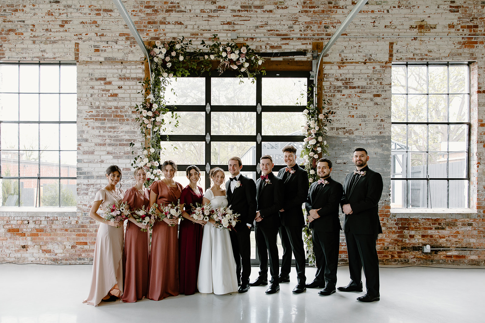 Wedding party The Graham Mill, a North Carolina wedding venue, captured by NC wedding photographers and videographers