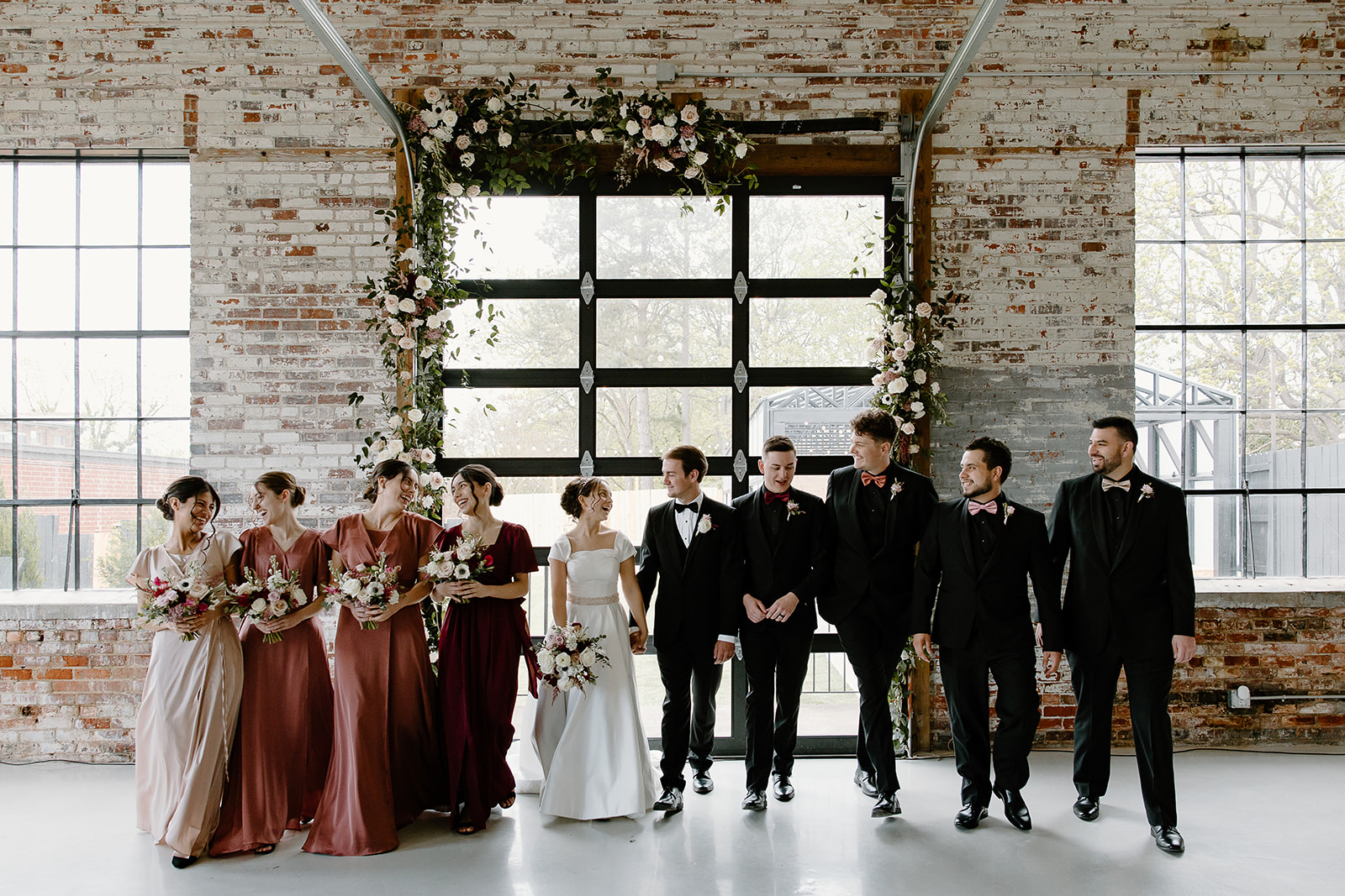 Wedding party The Graham Mill, a North Carolina wedding venue, captured by NC wedding photographers and videographers
