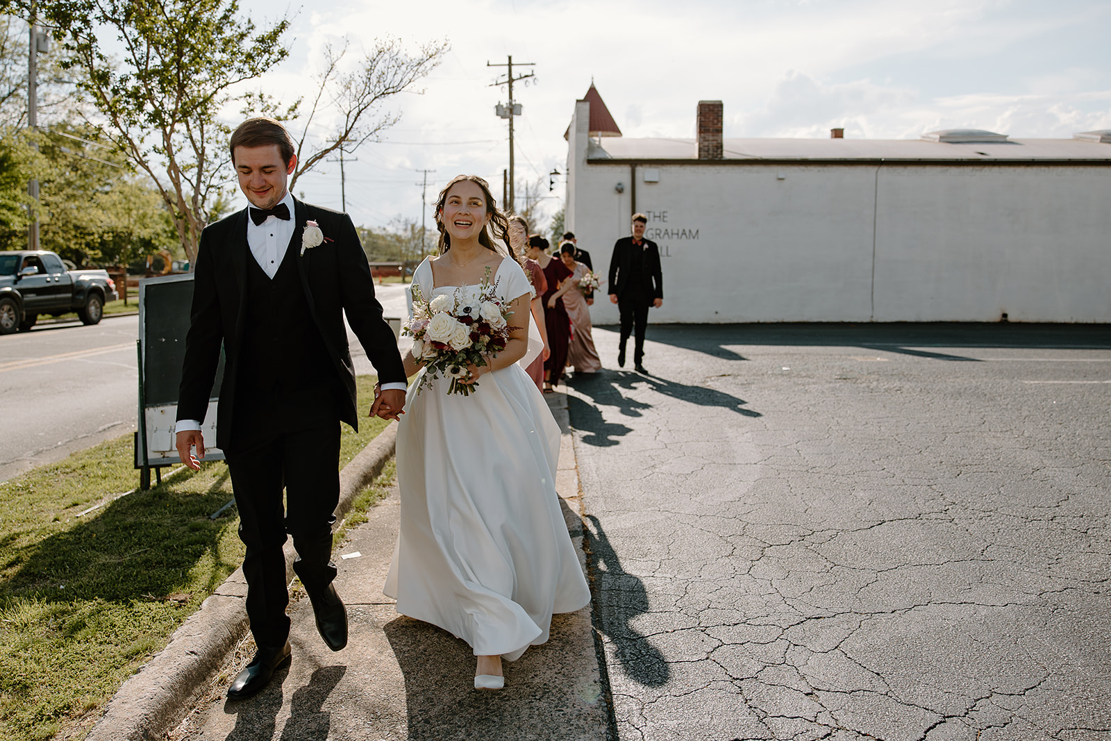 Downtown wedding party photos near The Graham Mill in North Carolina by Raleigh Wedding Photographers and Videographers