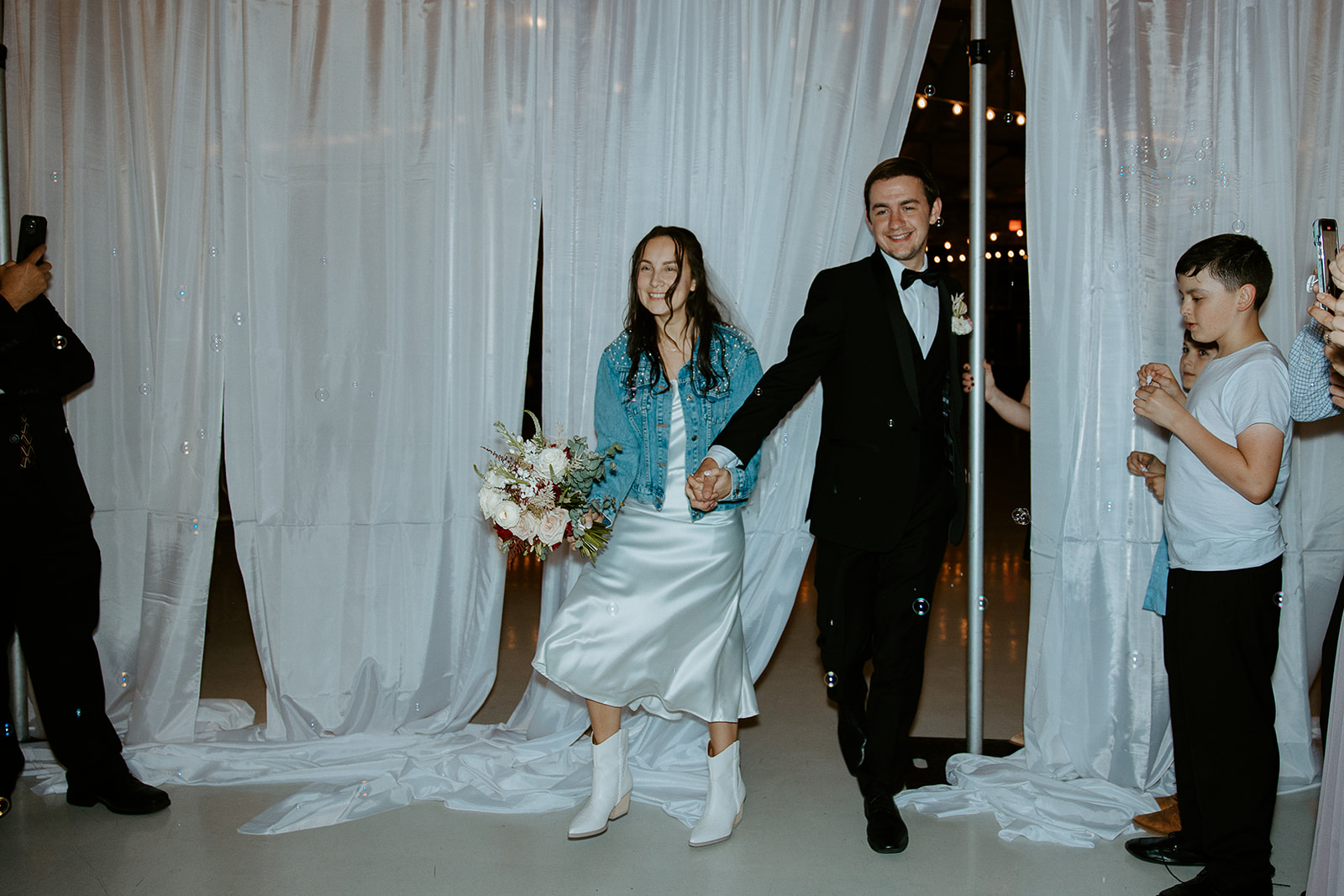 Bubble send off at The Graham Mill captured by North Carolina Wedding Photographers and Videographers