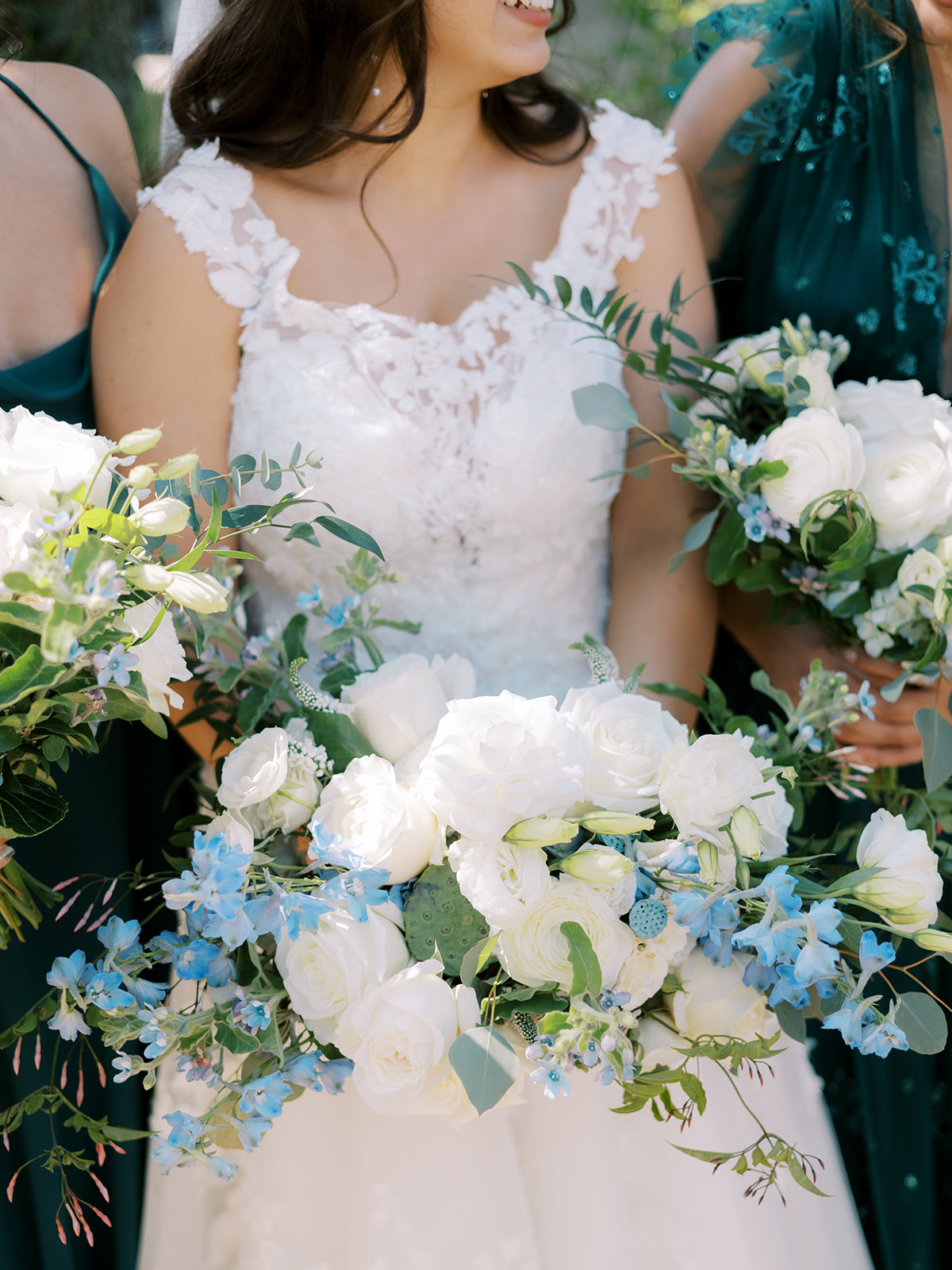 morais vineyard winery virginia bealeton wedding bride and groom portraits white roses blue flowers fluffy florals