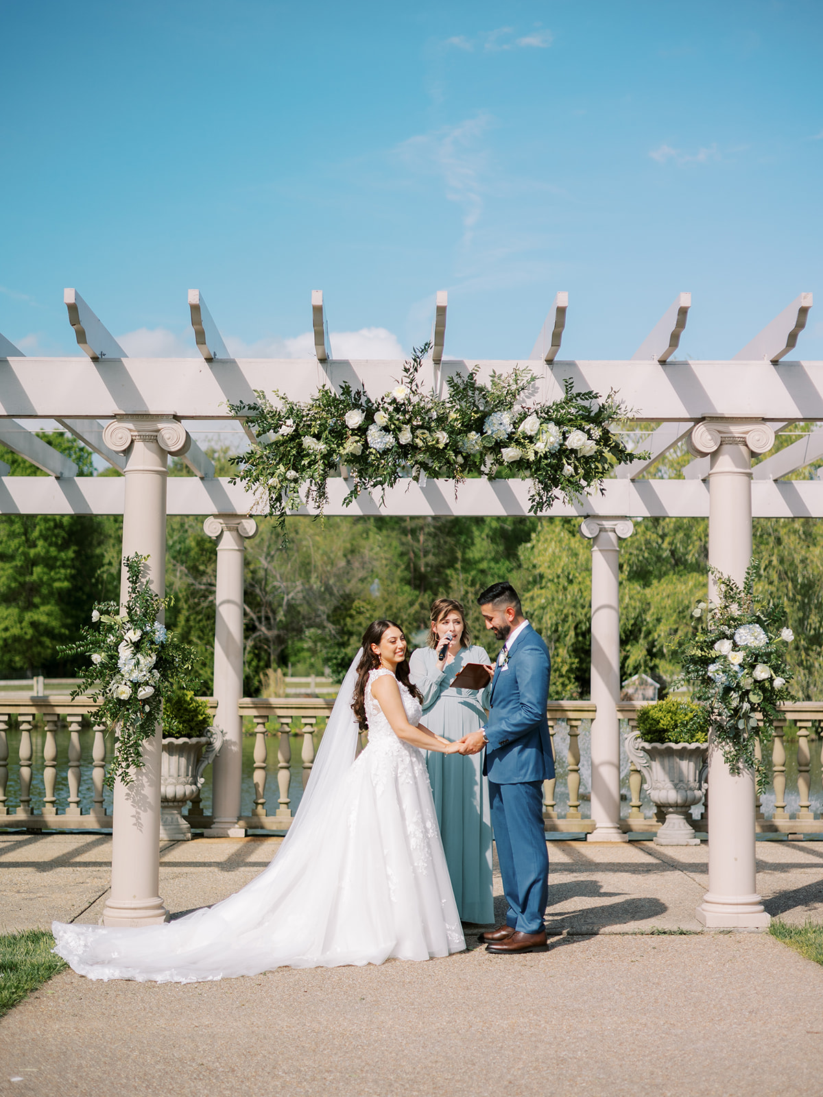 morais vineyard winery virginia bealeton wedding bride and groom arch outdoor ceremony hanging rose florals rustic decor