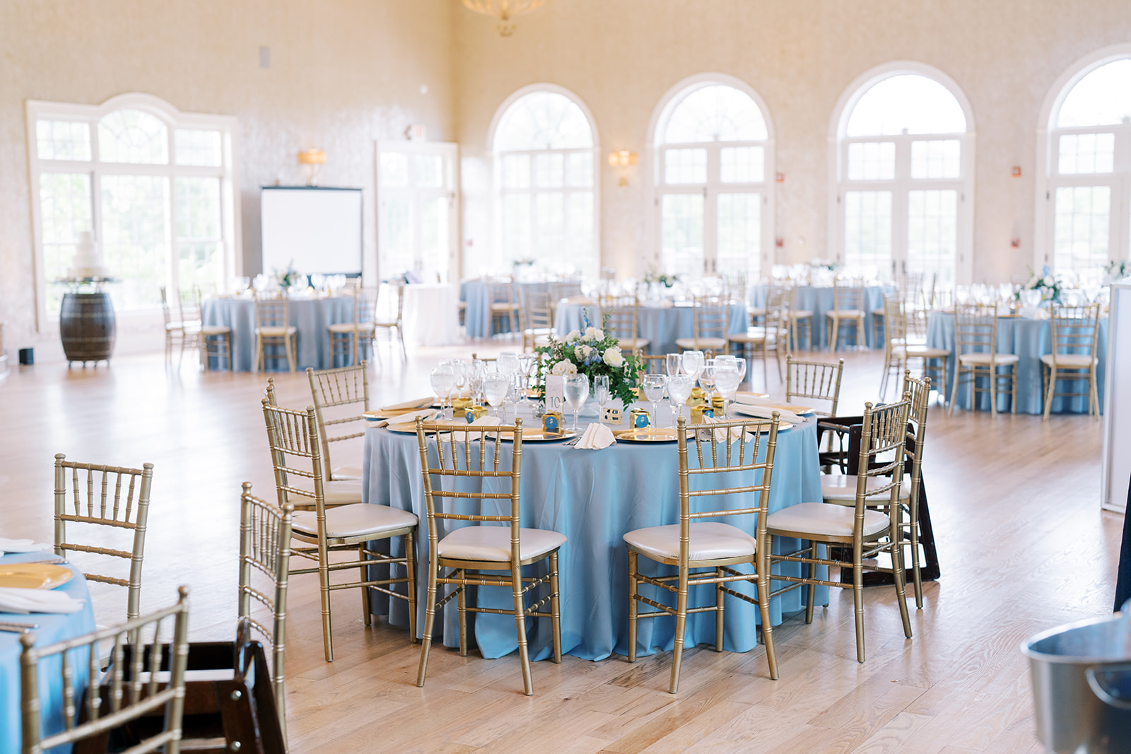 morais vineyard winery virginia bealeton wedding the palacio ballroom indoor reception blue table cloth white flowers