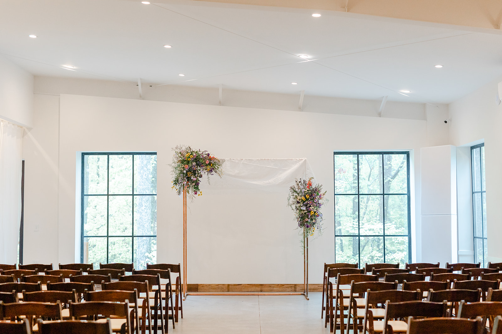 Rainy wedding day ceremony inside at the Meadows at Firefly Farm Preserve in Raleigh, North Carolina